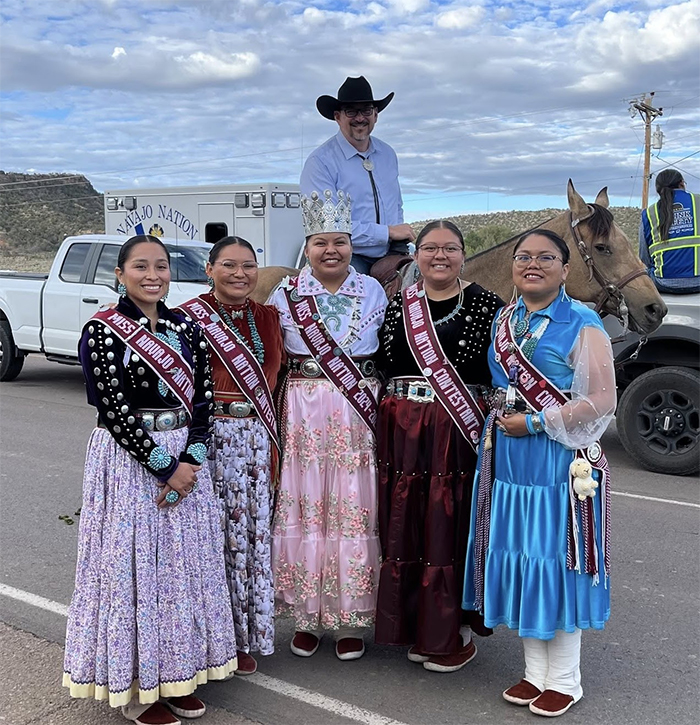 ecretary of State Aaron Fontes poses with Fair royalty.